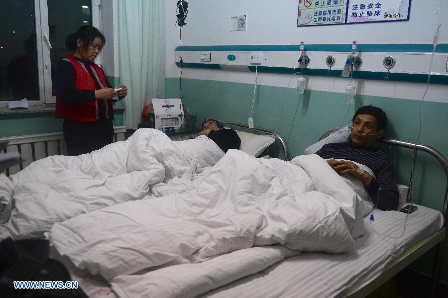 Victims of an accident involving carbon monoxide poisoning at a gold mine receive treatment at Renmin Hospital in Huadian, northeast China's Jilin Province, Jan. 15, 2013. Ten people were killed and 28 others injured after a fire broke out on early Tuesday morning inside the Laojinchang gold mine which resulted in a high density of carbon monoxide. Most of the 28 injured have kept out of danger, except that one seriously injured victim got serious respiratory burns. (Xinhua/Lin Hong)