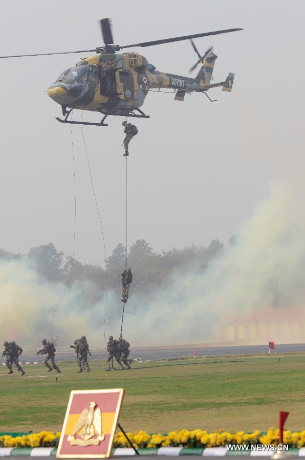 Indian army soldiers perform a combat demonstration during the army day parade in New Delhi, capital of India, Jan. 15, 2013. (Xinhua/Partha Sarkar)