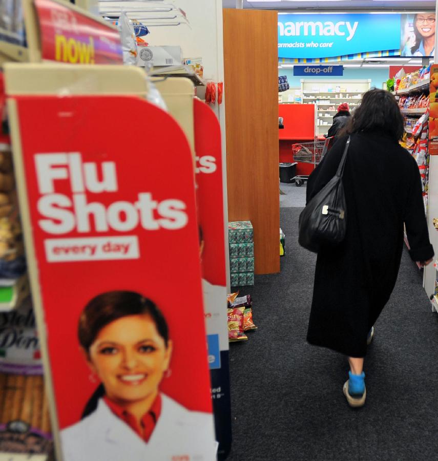 A woman walks in a CVS pharmacy store in New York, the United States, Jan. 15, 2013. As of Sunday, more than 20,000 cases of influenza have been reported in New York State for this season, far more than the 4, 404 cases that were reported in the last season. (Xinhua/Wang Lei) 