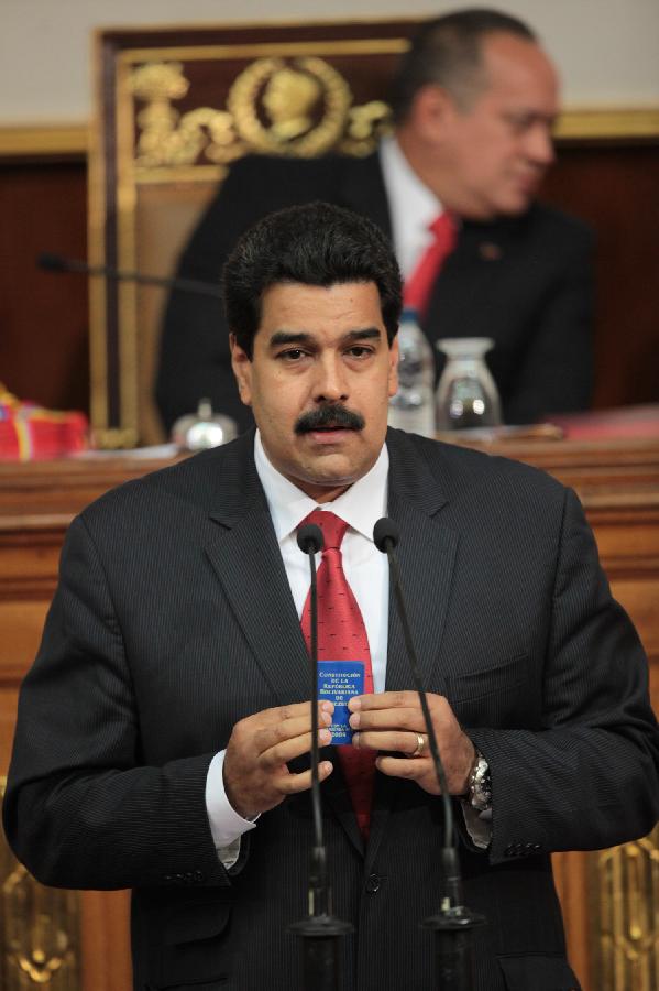 Venezuela's Vice President Nicolas Maduro (C) delivers the state of nation address to National Assembly in Caracas, Venezuela, on Jan. 15, 2013. Nicolas Maduro submitted the report in writing from ailing President Hugo Chavez who is receiving treatment in Cuba. (Xinhua/AVN) 