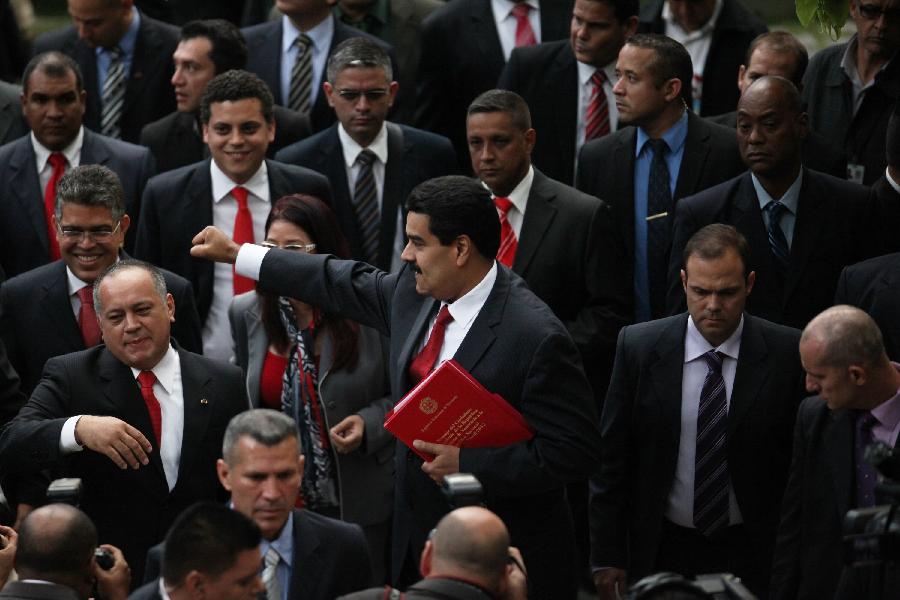 Venezuela's Vice President Nicolas Maduro (C), accompanied by Venezuela's National Assembly President Diosdado Cabello (L), reacts prior to deliver the state of nation address to National Assembly in Caracas, Venezuela, on Jan. 15, 2013. Nicolas Maduro submitted the report in writing from ailing President Hugo Chavez, who is receiving treatment in Cuba. (Xinhua/AVN) 