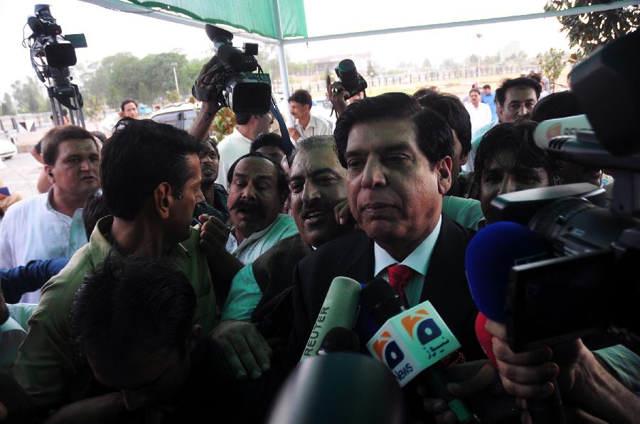 File photo taken on June 22, 2012, shows Raja Pervez Ashraf arriving at parliament house as nominated candidate for prime minister in Islamabad, Pakistan. Pakistani Supreme Court on Tuesday ordered the arrest of the country's Prime Minister Raja Pervez Ashraf involved in a corruption case, local media reported. (Xinhua/Ahmad Kamal)