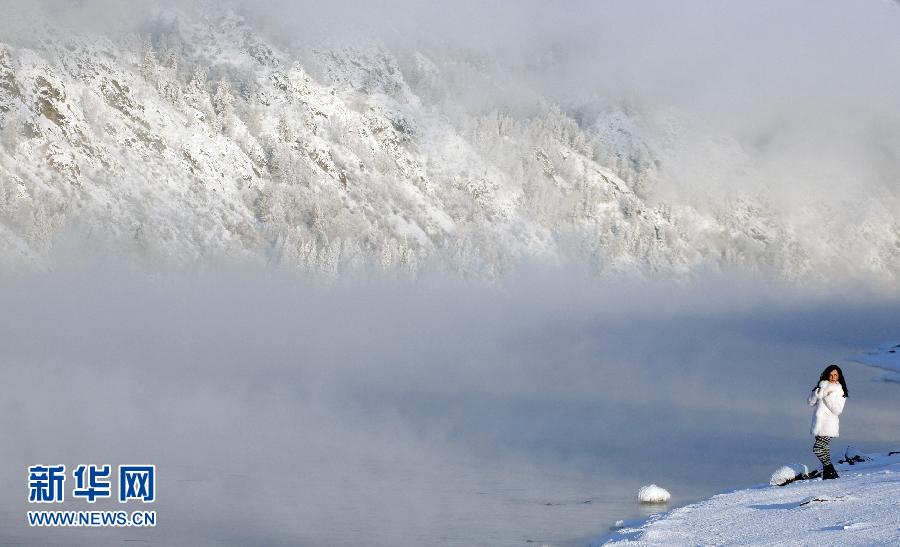 A woman takes pictures at the Yenisei River in Siberian region of Krasnoyarsk, Russia on Jan. 8, 2013. Frosty fog spreads above the Yenisei River, with an air temperature of about minus 25 degrees Celsius, some 45 kilometers (28 miles) south of Krasnoyarsk. (Xinhua/Reuters) 