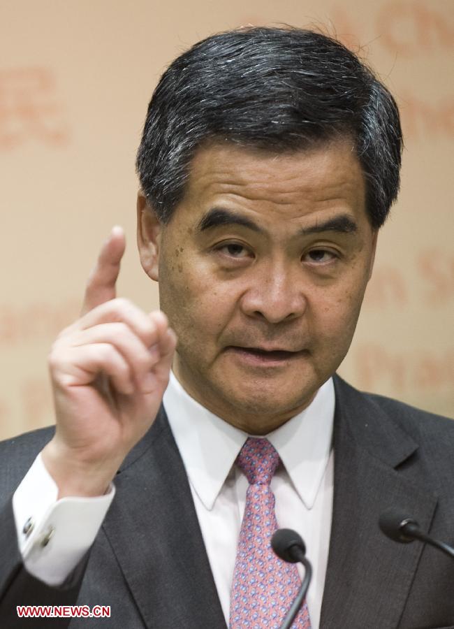 Hong Kong Chief Executive Leung Chun-Ying speaks to Journalist at a press conference after he delivered his 2013 Policy Address in Hong Kong, south China, Jan. 16, 2013. Leung delivered his first policy address on Wednesday morning at the Legislative Council here, outlining the city government's policy direction in 2013. (Xinhua/Lui Siu Wai)