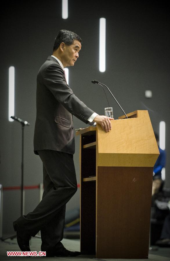 Hong Kong Chief Executive Leung Chun-Ying speaks to Journalist at a press conference after he delivered his 2013 Policy Address in Hong Kong, south China, Jan. 16, 2013. Leung delivered his first policy address on Wednesday morning at the Legislative Council here, outlining the city government's policy direction in 2013. (Xinhua/Lui Siu Wai)