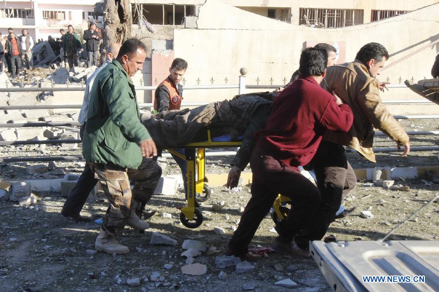 A victim is transported to hospital at the site of a bomb attack in Kirkuk, Iraq, on Jan. 16, 2013. Up to 17 people were killed and 133 wounded in two bomb attacks targeting offices of Kurdish parties in the ethnically mixed cities of Kirkuk and Tuz-Khurmato in northern Iraq on Wednesday, according to the police. (Xinhua/Dina Assad)
