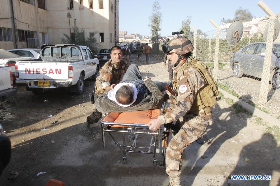 An injured is transported to hospital at the site of bomb attack in Kirkuk, Iraq, on Jan. 16, 2013. Up to 17 people were killed and 133 wounded in two bomb attacks targeting offices of Kurdish parties in the ethnically mixed cities of Kirkuk and Tuz-Khurmato in northern Iraq on Wednesday, according to the police. (Xinhua/Dina Assad)