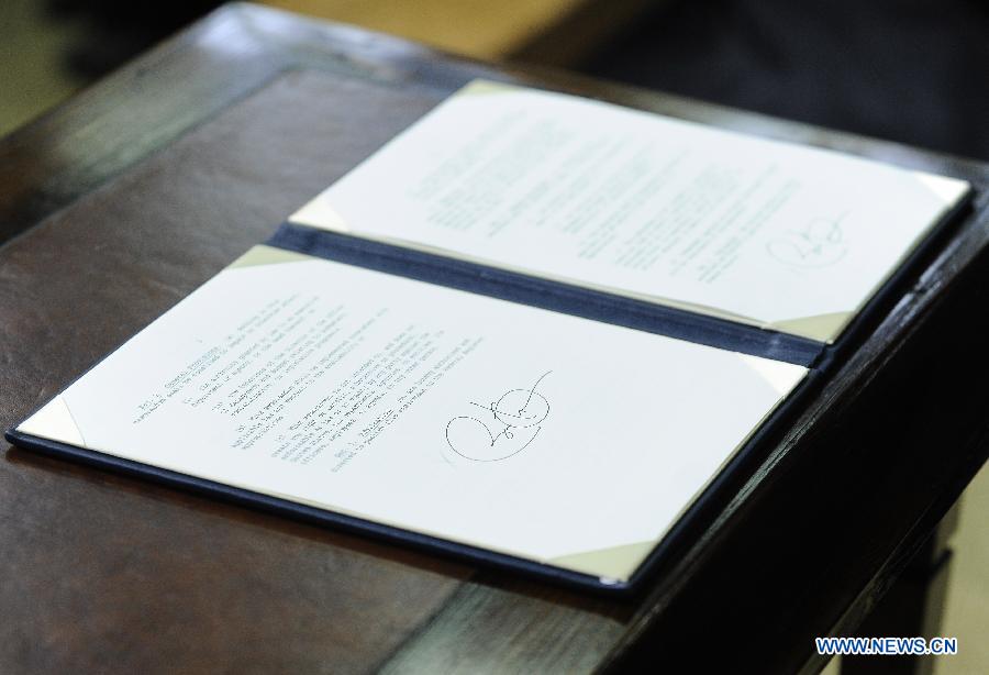 U.S. President Barack Obama's signature is seen on one of the 23 executive orders on gun violence he signed during an event at the White House in Washington D.C., capital of the United States, Jan. 16, 2013. Obama on Wednesday unveiled a sweeping and expansive package of gun violence reduction proposals, a month after the Sandy Hook Elementary School mass shooting killed 26 people including 20 schoolchildren. (Xinhua/Zhang Jun)