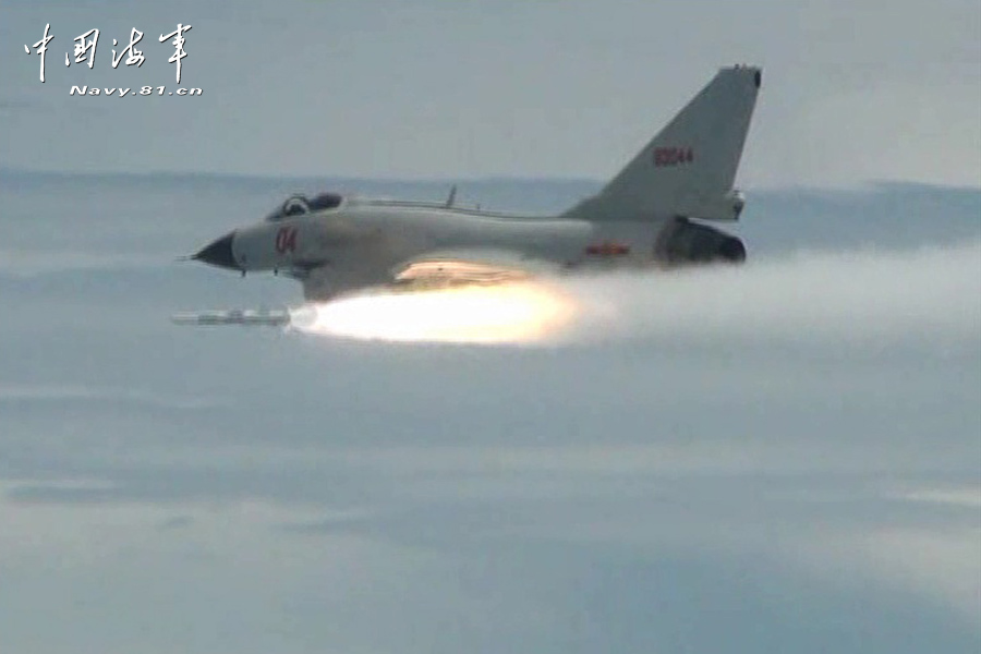 A flight delegation of China's naval air force conducts a long-range raid exercise, and they shoot down the simulated "enemy aircraft" during the exercise. The exercise marked a new breakthrough in their precision raid and actual combat capability. (navy.81.cn/Li Ronglei, Wang Zhenbing)