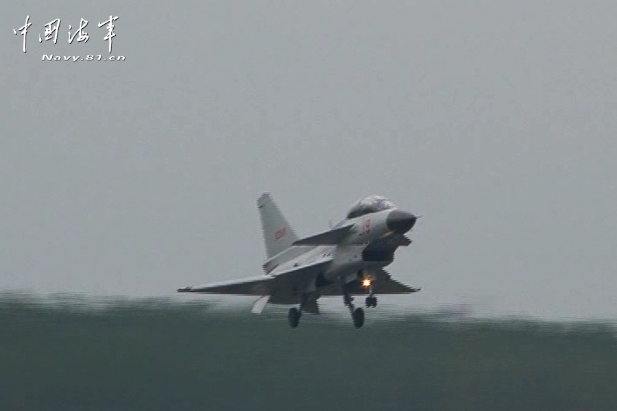 A flight delegation of China's naval air force conducts a long-range raid exercise, and they shoot down the simulated "enemy aircraft" during the exercise. The exercise marked a new breakthrough in their precision raid and actual combat capability. (navy.81.cn/Li Ronglei, Wang Zhenbing)