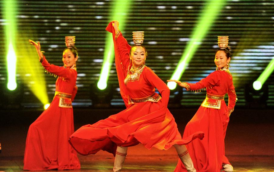 Dancers perform during a variety show for the Snow and Ice Culture Festival in Xilinhot City, north China's Inner Mongolia Autonomous Region, Jan. 18, 2013. The festival will last from Jan. 18 to Feb. 25. (Xinhua/Zhao Tingting) 