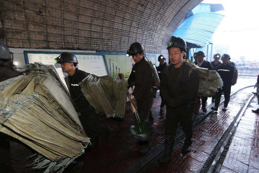 Rescuers arrive at the accident site after a coal and gas outburst occurred at the Jinjia Coal Mine under the Panjiang Investment Holding Group in southwest China's Guizhou Province, Jan. 19, 2013. The accident, which happened Friday afternoon, has left two people dead and 11 others trapped. (Xinhua/Huang Shujin) 