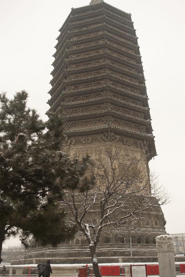 Photo taken on Jan. 20, 2013 shows the Tianning Temple Pagoda after a snow hit Beijing, capital of China. (Xinhua/Yin Xubao) 