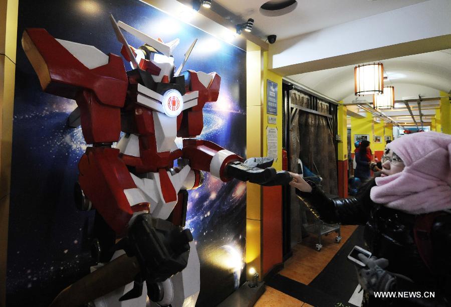 A robot greets customers in a robot themed restaurant in Harbin, capital of northeast China's Heilongjiang Province, Jan. 18, 2013. Opened in June of 2012, the restaurant has gained fame by using a total of 20 robots to cook meals, deliver dishes and greet customers. (Xinhua/Wang Jianwei) 