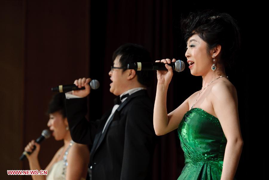 Chinese students studying in Russia sing a song during a performance staged at the Chinese Embassy in Moscow, Russia, Jan. 20, 2013. The performance was held here on Sunday in celebration of China's traditional Spring Festival and the upcoming Year of the Snake. (Xinhua/Jiang Kehong) 