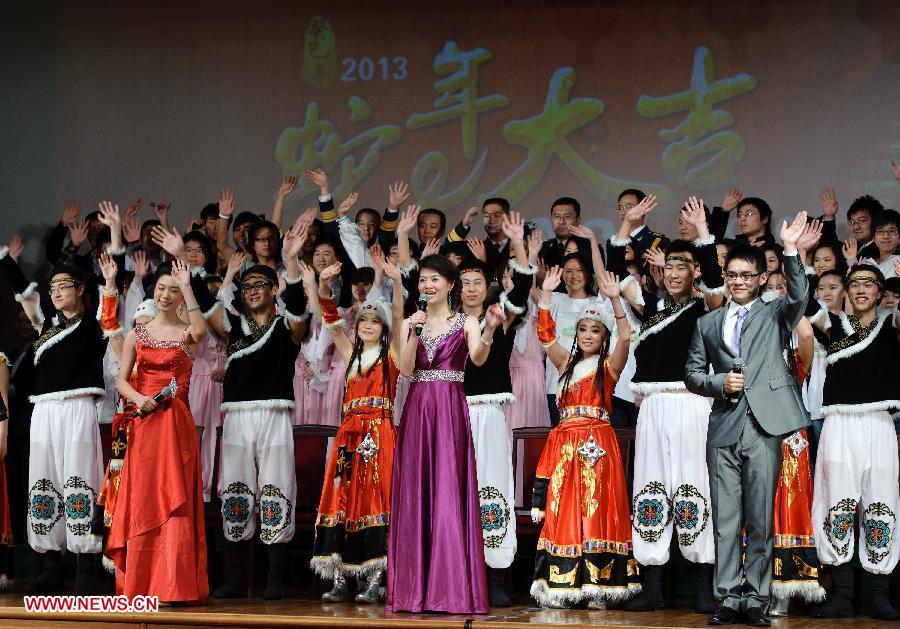Chinese students studying in Russia take curtain call and wave hands to audiance during a performance staged at the Chinese Embassy in Moscow, Russia, Jan. 20, 2013. The performance was held here on Sunday in celebration of China's traditional Spring Festival and the upcoming Year of the Snake. (Xinhua/Jiang Kehong)