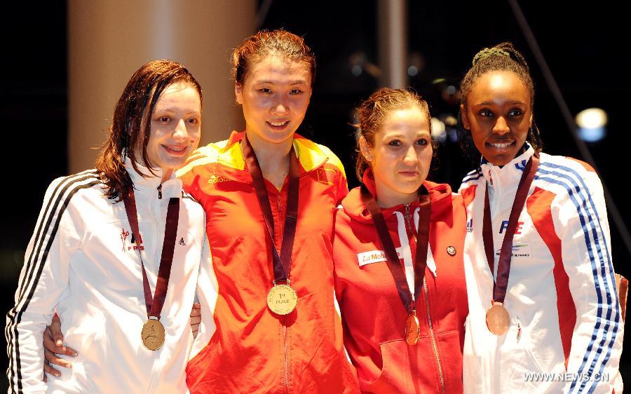 Gold medalist Xu Anqi (2nd L) of China, silver medalist Ana Maria Branza (L) of Romania, bronze medalists Tiffany Geroudet (R2) of Swizterland and Lauren Rembi of France pose during the awarding ceremony for the women's epee at the Grand Prix of Qatar in Doha, Jan. 20, 2013. (Xinhua/Chen Shaojin) 