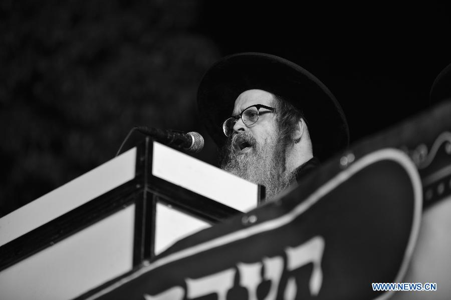 Visiting Grand Rabbi of the Satmar hassidic dynasty Rabbi Zalman Leib Teitelbaum from the United States attends a rally in Jerusalem's ultra-Orthodox neighborhood of Mea Shearim on Jan. 20, 2013. (Xinhua/Yin Dongxun) 