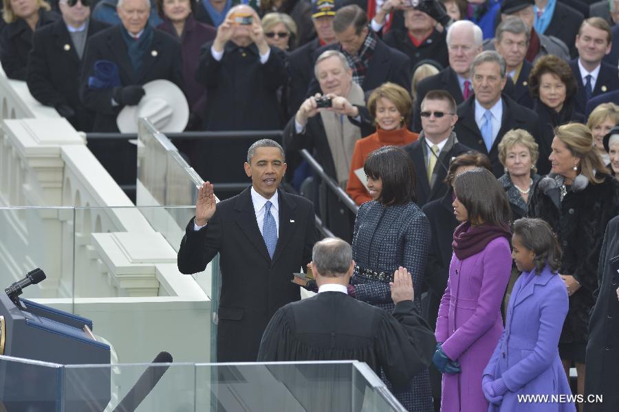 U.S. President Barack Obama (L) takes the oath of office during the presidential inauguration ceremony on the West Front of the U.S. Capitol in Washington D.C., the United States, on Jan. 21, 2013. (Xinhua/Zhang Jun) 