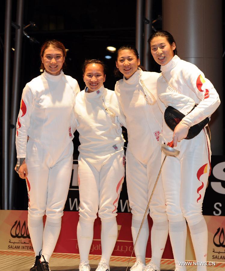 Xu Anqi, Tang Yiling, Yin Mingfang and Sun Yujie (from L to R) of team China pose after the awarding ceremony for the women's epee team final at the Fencing Grand Prix and World Cup in Doha, Jan. 21, 2013. Team China defeated team Estonia to claim the title. (Xinhua/Chen Shaojin) 