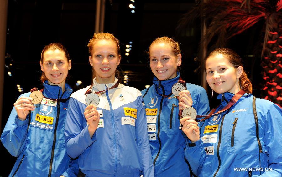 Silver medalist team Estonia poses on the podium during the awarding ceremony for the women's epee team final at the Fencing Grand Prix and World Cup in Doha, Jan. 21, 2013. (Xinhua/Chen Shaojin) 