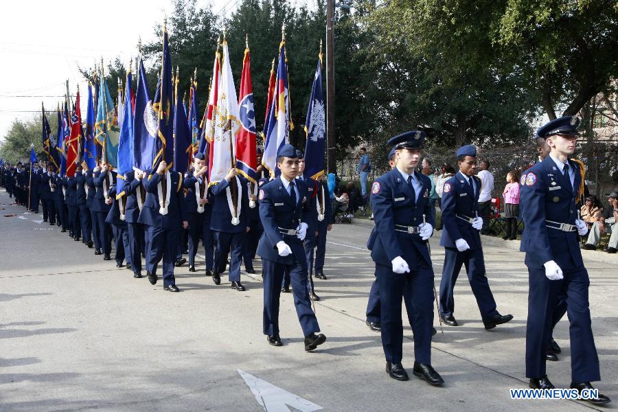 People take part in the Martin Luther King Parade in Houston, the United States, on Jan. 21, 2013. (Xinhua/Song Qiong) 