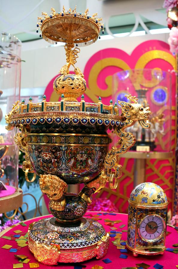 Photo taken on Jan. 22, 2013 shows the cloisonne works made by artist Zhang Tonglu during an exhibition in south China's Hong Kong. An exhibition of Zhang Tonglu's cloisonne art works was held here on Tuesday, showing 22 pieces of cloisonne works. (Xinhua/Li Peng)