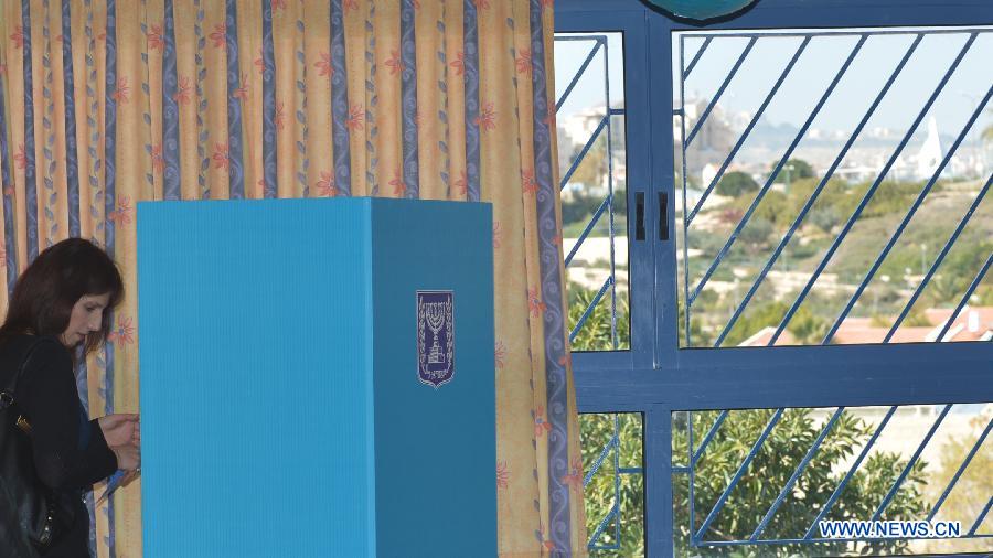 A Jewish settler casts her ballot in a polling station in Jewish settlement Maale Adumin in the West Bank, Jan. 22, 2013. Israel held parliamentary election on Tuesday.(Xinhua/Yin Dongxun)