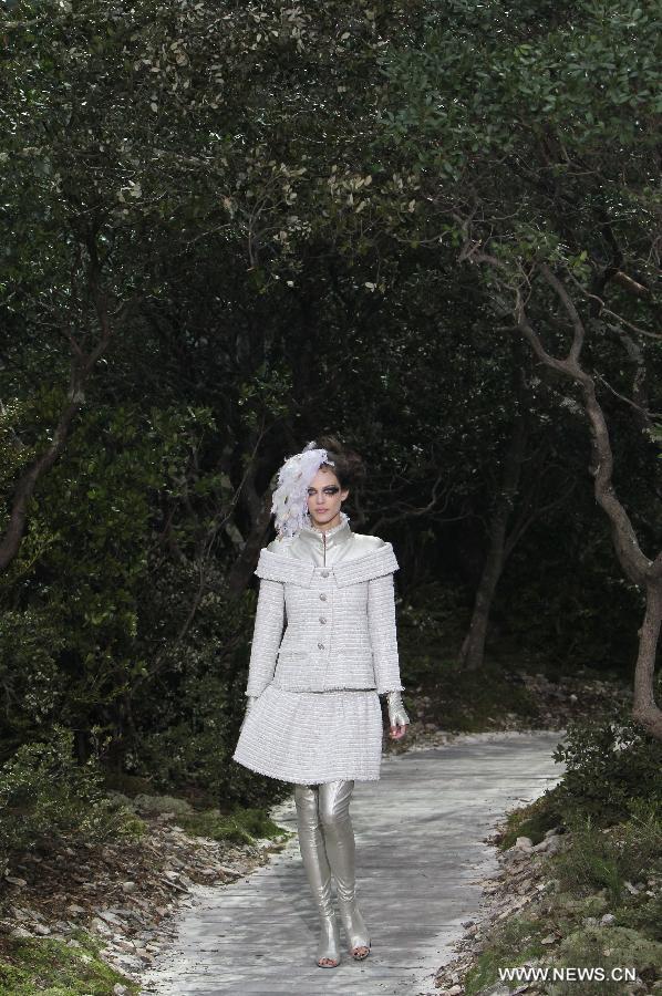 A model presents a creation by German designer Karl Lagerfeld for French fashion house Chanel during the Haute Couture Spring-Summer 2013 collection shows in Paris, France, Jan. 22, 2013. (Xinhua/Gao Jing) 