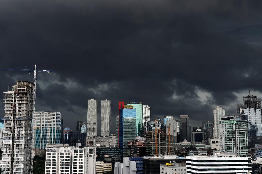Clouds cover the sky of Jakarta, Indonesia, on Jan. 23, 2013. According to Indonesia's Meteorology, Climatology and Geophysics agency (BMKG), Jakarta is still threatened by heavy rains and floods up to Sunday. At least 26 were reportedly killed in the floods that submerged houses and affected more than 250,000 people in Indonesia's capital city since last Tuesday. (Xinhua/Veri Sanovri)
