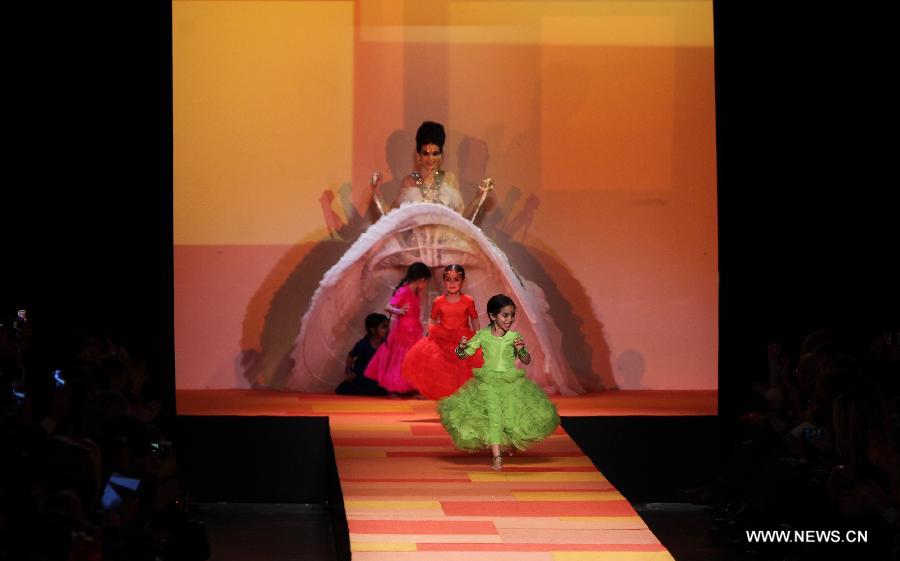 A model displays a creation by French designer Jean Paul Gaultier during the Haute Couture Spring-Summer 2013 collection shows in Paris, France, Jan. 23, 2013. (Xinhua/Gao Jing) 