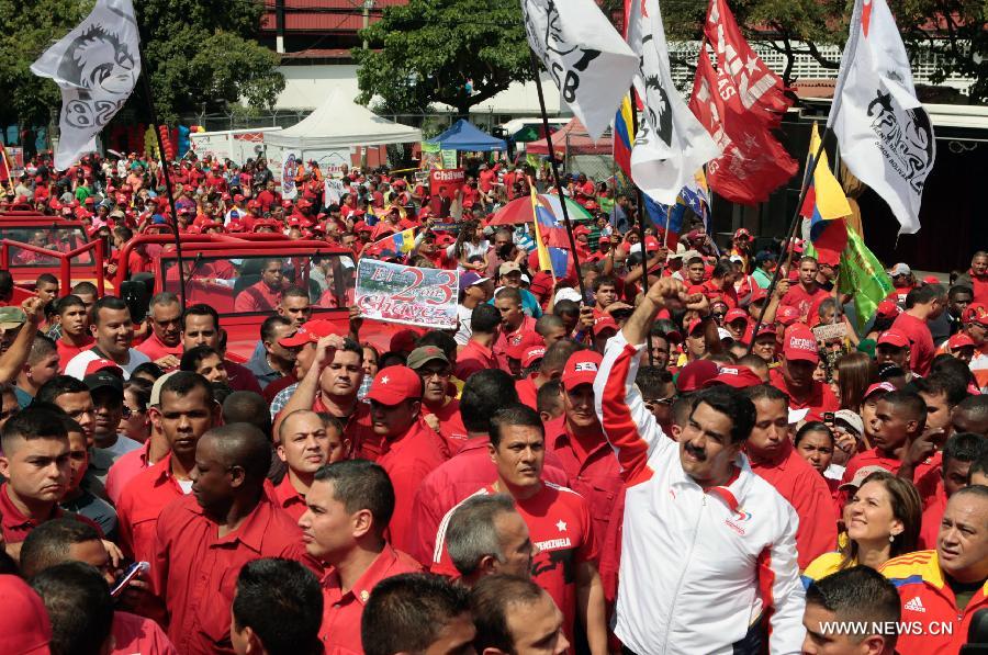 Image provide by Presidency of Venezuela, shows Venezuelan Vice President Nicolas Maduro (in white clothes) attending a rally to commemorate the 55th anniversary of democracy, in Caracas, capital of Venezuela, on Jan. 23, 2013. (Xinhua/Presidency of Venezuela) 