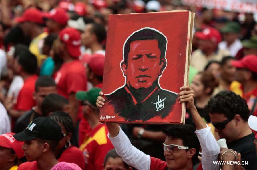 Image provide by Presidency of Venezuela, shows supporters of Venezuelan President Hugo Chavez attending a rally to commemorate the 55th anniversary of democracy, in Caracas, capital of Venezuela, on Jan. 23, 2013. (Xinhua/Presidency of Venezuela) 