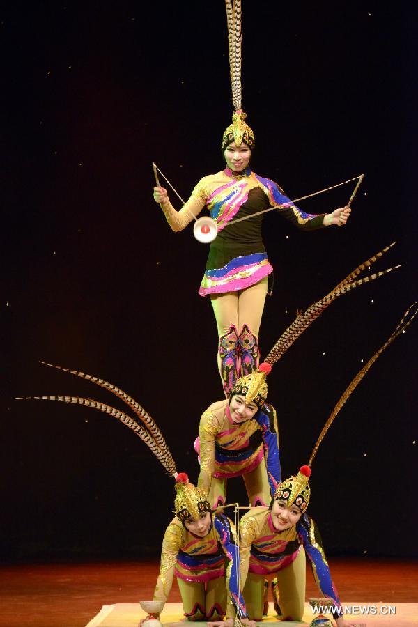 Acrobats of the Chinese Acrobatic Troupe perform in Johannesburg, South Africa, Jan. 23, 2013. Twenty-five acrobats of the Chinese Acrobatic Troupe made their debut in Johannesburg on Wednesday night. They are here to attend the celebrations of the 15th anniversary of the establishment of the diplomatic relations between China and South Africa, and also the upcoming Chinese lunar New Year. (Xinhua/Wen Shi