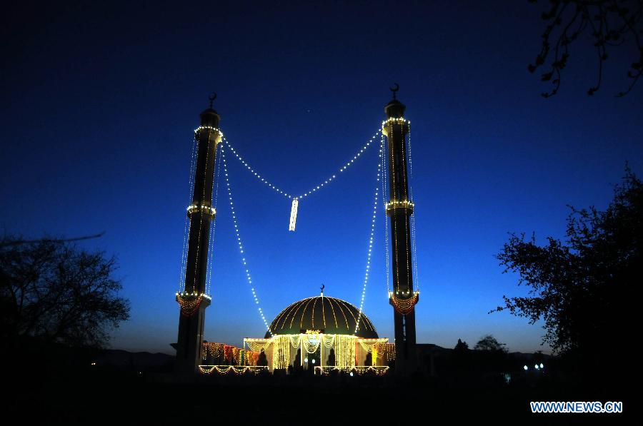 An illuminated mosque is seen during celebrations ahead of Eid-e-Milad-un-Nabi, marking the birth anniversary of the Islam's Prophet Mohammed, in northwest Pakistan's Peshawar on Jan. 24, 2013. (Xinhua Photo/Umar Qayyum)