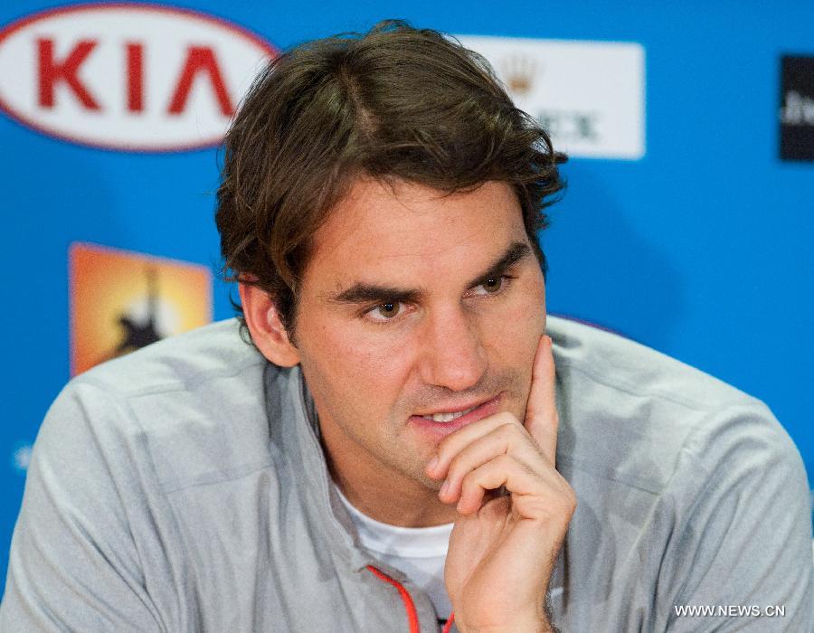 Roger Federer of Switzerland reacts during the press conference after the men's singles semifinal match against Andy Murray of Britain at the 2013 Australian Open tennis tournament in Melbourne, Australia, Jan. 25, 2013. Roger Federer lost 2-3. (Xinhua/Bai Xue) 