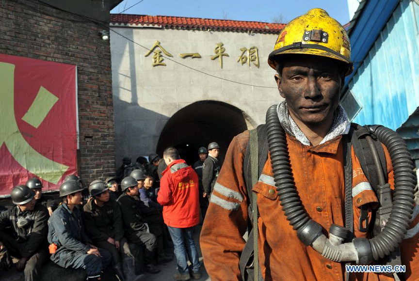 A rescuer leaves after a rescue operation at the Jinjia Coal Mine in Panxian County, southwest China's Guizhou Province, Jan. 23, 2013. All the 13 miners trapped in the Jinjia Coal Mine after a coal and gas outburst were confirmed dead, rescuers said on Jan. 24, seven days after the accident. (Xinhua/Yang Ying) 