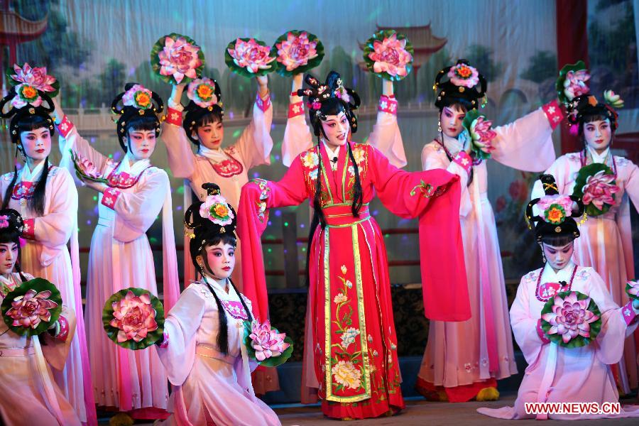 Actresses perform Puxian opera, one of the oldest forms of Chinese opera, at the Dongqin Village in Putian City, southeast China's Fujian Province, Jan. 26, 2013. Puxian opera, which originated from puppet shows, has been listed as a national intangible cultural heritage. (Xinhua/Lin Jianbing) 
