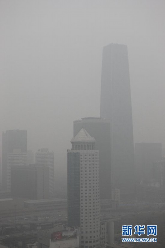 Skyscrapers in the Beijing Central Business District are enveloped by fog, Jan. 13. Beijing's meteorological center on Monday issued a yellow-coded alert for haze as the fourth foggy weather in this month hit the city and cuts the visibility below 3,000 meters in major parts of Beijing. (Photo/Xinhua)