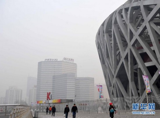 A photo taken on Jan. 13 shows the National Stadium, or the Bird's Nest under grey sky. Beijing's meteorological center on Monday issued a yellow-coded alert for haze as the fourth foggy weather in this month hit the city and cuts the visibility below 3,000 meters in major parts of Beijing. Beijing's meteorological center on Monday issued a yellow-coded alert for haze as the fourth foggy weather in this month hit the city and cuts the visibility below 3,000 meters in major parts of Beijing. (Photo/Xinhua)
