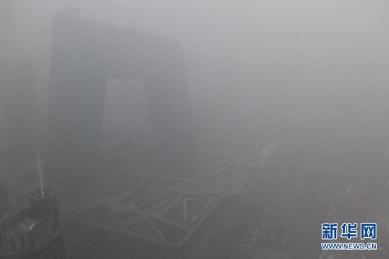 A photo taken on Jan. 23 shows the foggy landscape of the Central Business District in Beijing. Beijing's meteorological center on Monday issued a yellow-coded alert for haze as the fourth foggy weather in this month hit the city and cuts the visibility below 3,000 meters in major parts of Beijing. (Photo/Xinhua)