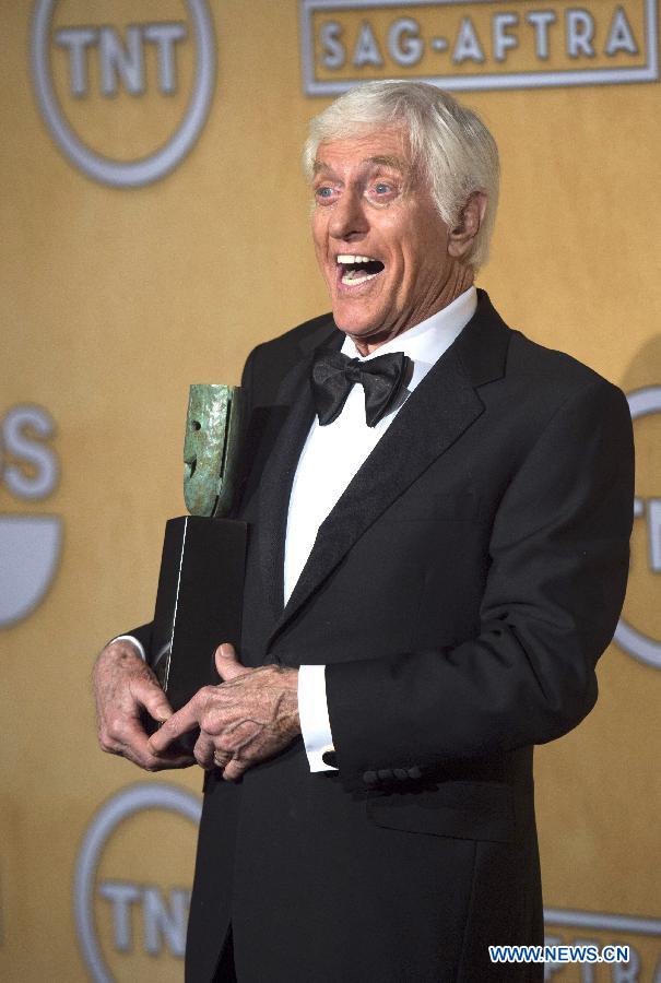 Actor Dick Van Dyke poses with his trophy after recieving the life achievement award at the 19th annual Screen Actors Guild Awards in Los Angeles, California, January 27, 2013. (Xinhua/Yang Lei)