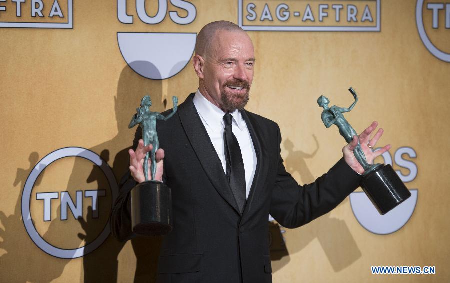 Actor Bryan Cranston poses with his trophies after receiving the awards for outstanding male actor in a drama series for "Breaking Bad" and for outstanding cast in a motion picture for "Argo" at the 19th annual Screen Actors Guild Awards in Los Angeles, California January 27, 2013. (Xinhua/Yang Lei)