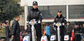 Policemen are on patrol to secure railway's safety in Chongqing North Railway Station on Jan 26, 2013.