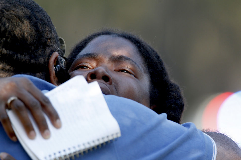 Lone Star College freshman Sheketa Taylor hugs her father Judson Gimblin after they found each other on the Lone Star Campus following Tuesday's shooting. (Xinhua/AFP)