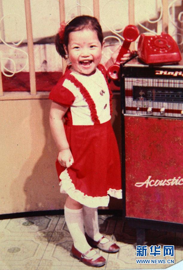 Photo reproduced from an old photo shows five-year-old Li Na. (Xinhua/Zhou Guoqiang)