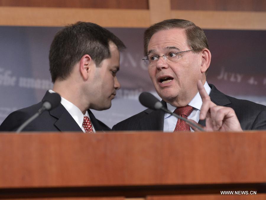 U.S. Senators Robert Menendez (R, R-AZ) and Marco Rubio (R-FL) attend a press conference on bipartisan framework for comprehensive immigration reform on Capitol Hill, in Washington D.C., capital of the United States, Jan. 28, 2013. (Xinhua/Zhang Jun) 