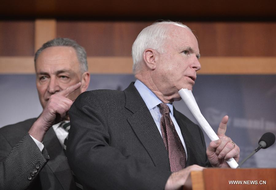 U.S. Senators John McCain (right, R-AZ) and Charles Schumer (D-NY) attend a press conference on bipartisan framework for comprehensive immigration reform on Capitol Hill, in Washington D.C., capital of the United States, Jan. 28, 2013. (Xinhua/Zhang Jun) 