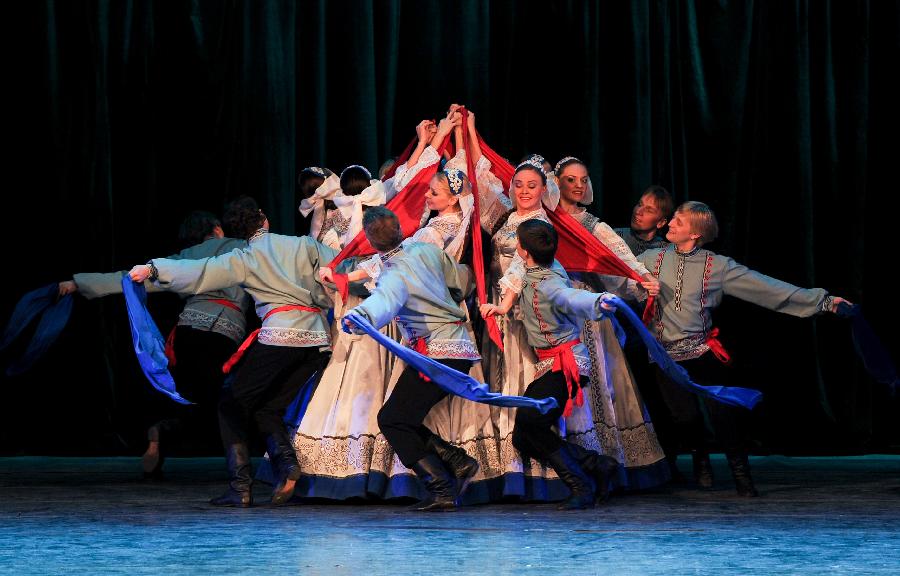 Artists of the National Little Birch Tree Dance Troupe of Russia perform at the Oriental Theatre in Changchun, capital of northeast China's Jilin Province, Jan. 28, 2013. The performance was staged to greet the upcoming Spring Festival which falls on Feb. 10 this year. (Xinhua/Xu Chang)
