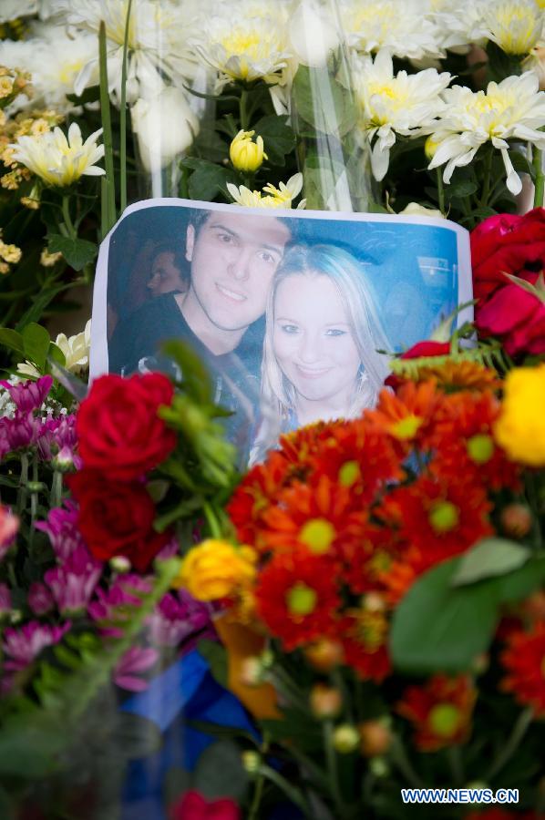 A photo of victims is seen in front of the Kiss nightclub in Santa Maria, Brazil, Jan. 29, 2013. A total of 231 people died in a fire that swept through a nightclub in the city of Santa Maria, in Rio Grande do Sul state, southern Brazil Saturday night. (Xinhua/Weng Xinyang)